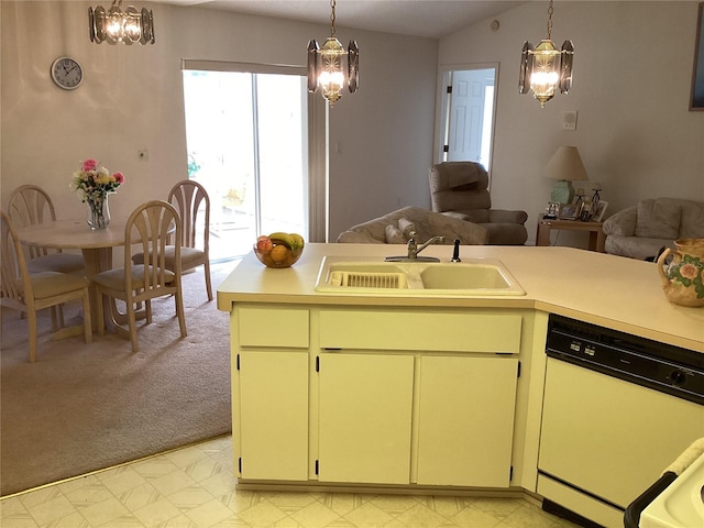 kitchen with pendant lighting, white dishwasher, light colored carpet, and sink