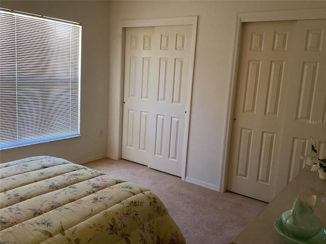 bedroom with light carpet