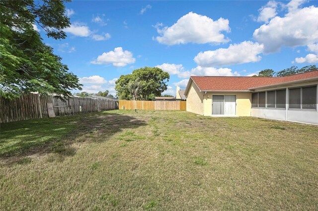 10412 Ireland St, Spring Hill, FL 34608 - view of yard featuring a fenced backyard and a sunroom