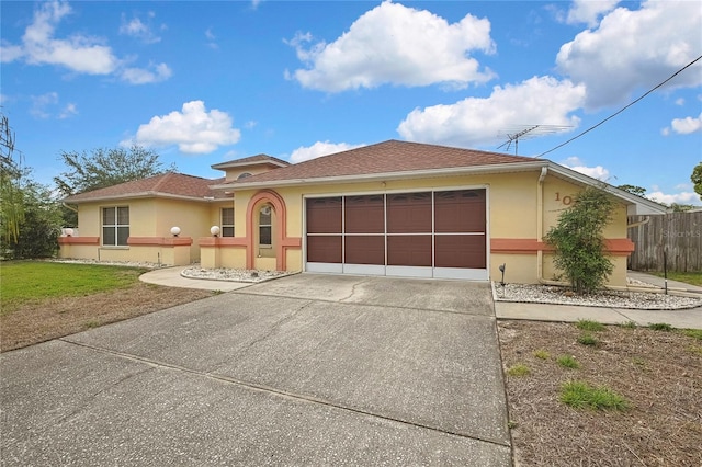 10412 Ireland St, Spring Hill, FL 34608 - ranch-style house featuring stucco siding, an attached garage, fence, and concrete driveway