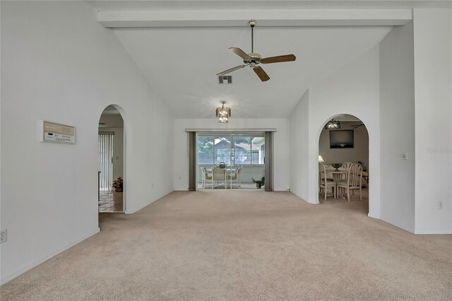 10412 Ireland St, Spring Hill, FL 34608 - carpeted empty room featuring high vaulted ceiling, beamed ceiling, visible vents, arched walkways, and ceiling fan