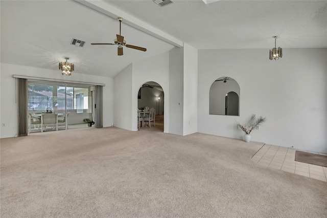 10412 Ireland St, Spring Hill, FL 34608 - unfurnished living room featuring carpet flooring, visible vents, beam ceiling, arched walkways, and ceiling fan with notable chandelier