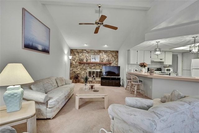 10412 Ireland St, Spring Hill, FL 34608 - living area featuring ceiling fan, visible vents, light carpet, vaulted ceiling with beams, and a fireplace