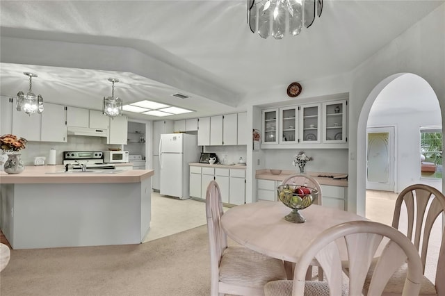 10412 Ireland St, Spring Hill, FL 34608 - dining room with arched walkways, visible vents, and an inviting chandelier