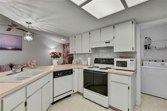 10412 Ireland St, Spring Hill, FL 34608 - kitchen with tasteful backsplash, white appliances, under cabinet range hood, a sink, and washer / dryer