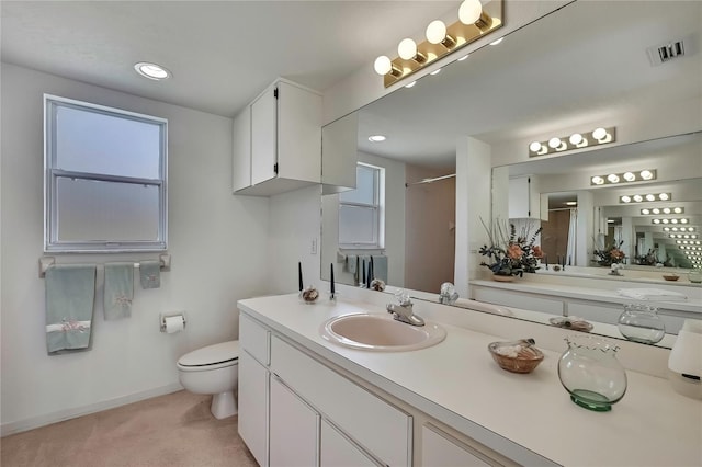 10412 Ireland St, Spring Hill, FL 34608 - full bath featuring visible vents, a shower, baseboards, toilet, and vanity