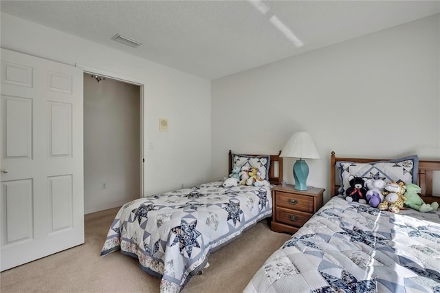 10412 Ireland St, Spring Hill, FL 34608 - bedroom featuring visible vents, carpet floors, and a textured ceiling