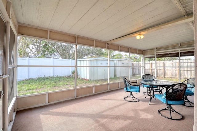 sunroom with wooden ceiling