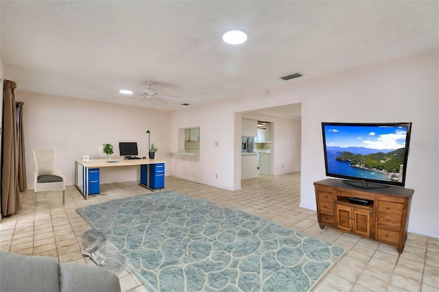 tiled office space with ceiling fan