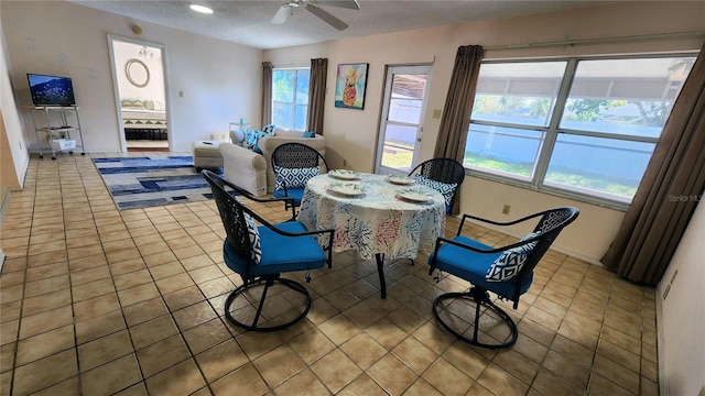 dining area featuring light tile patterned floors, a textured ceiling, a ceiling fan, and recessed lighting