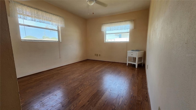 spare room with ceiling fan and wood finished floors