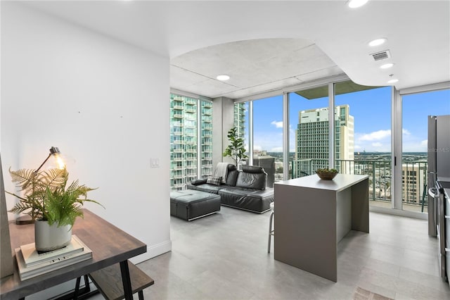 office area featuring floor to ceiling windows