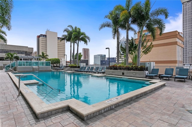 view of swimming pool featuring a patio area