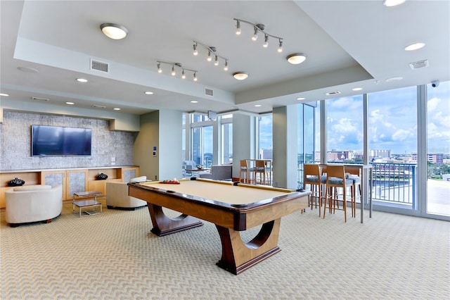 game room with pool table, plenty of natural light, and expansive windows