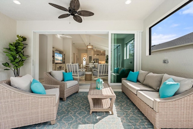 sunroom with ceiling fan