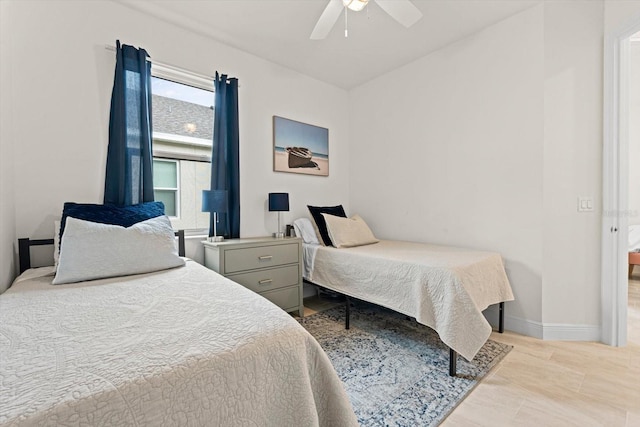 bedroom featuring a ceiling fan and baseboards