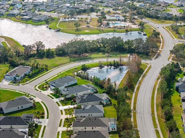 birds eye view of property featuring a water view and a residential view