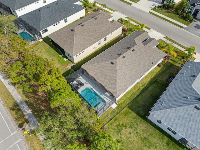 birds eye view of property with a residential view