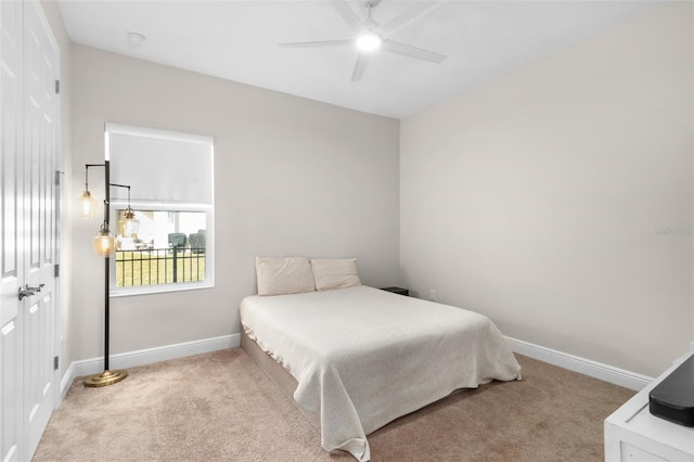 bedroom with carpet flooring, a closet, and ceiling fan