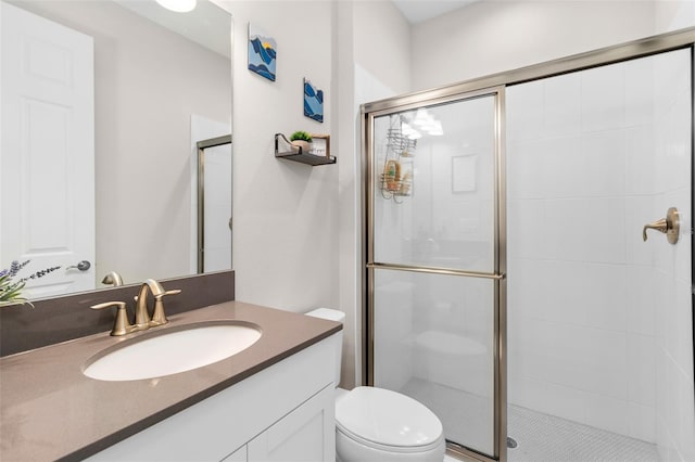 bathroom with vanity, toilet, and walk in shower