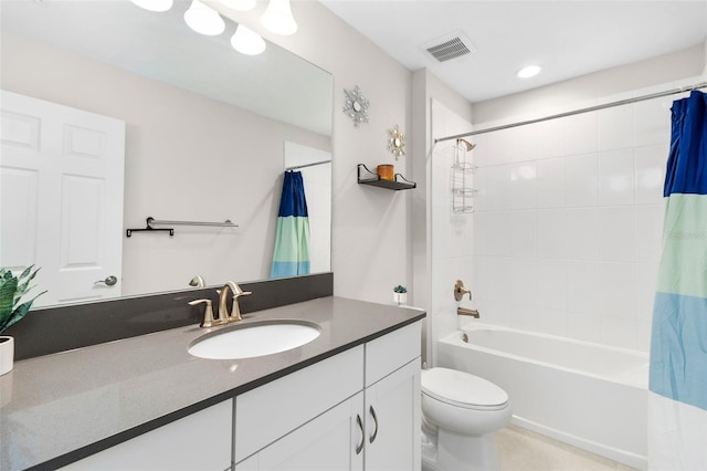 full bathroom featuring shower / tub combo with curtain, vanity, and toilet