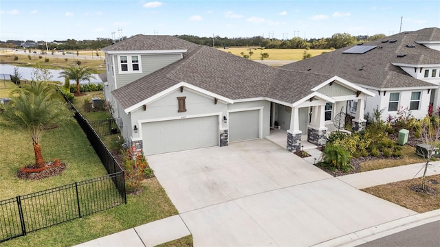 view of front of property featuring central AC, a front yard, and a garage