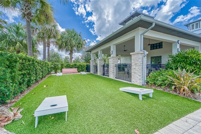 view of yard with ceiling fan