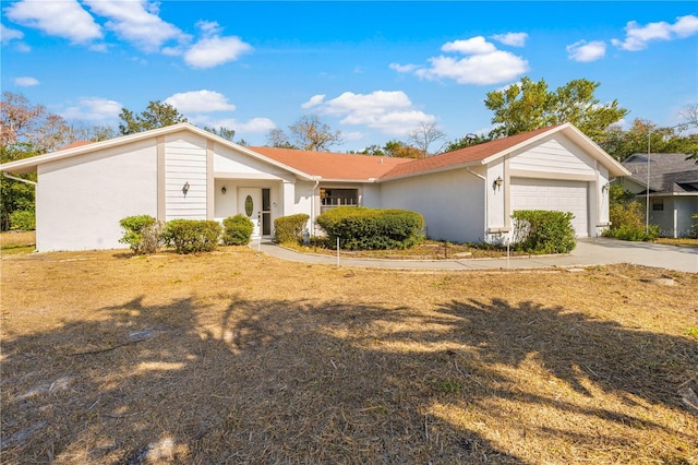 single story home featuring a garage