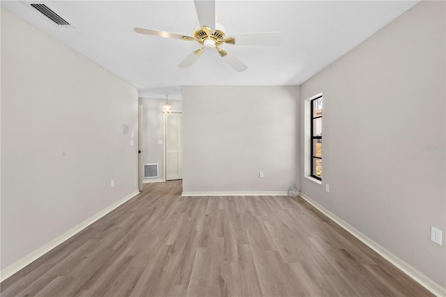 empty room with light wood-type flooring and ceiling fan