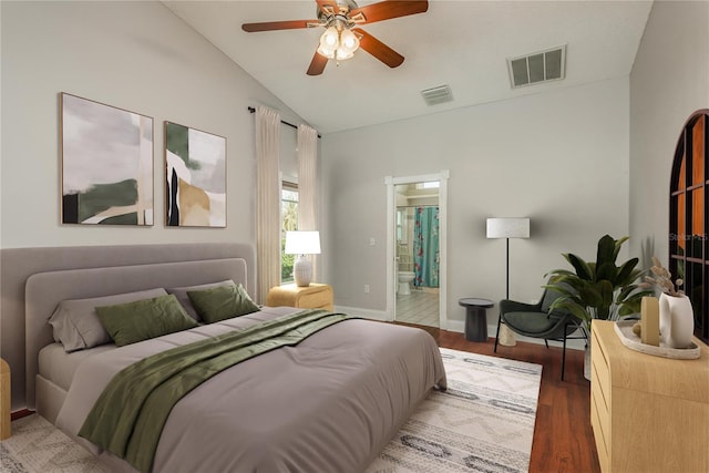 bedroom featuring ceiling fan, lofted ceiling, wood-type flooring, and ensuite bath