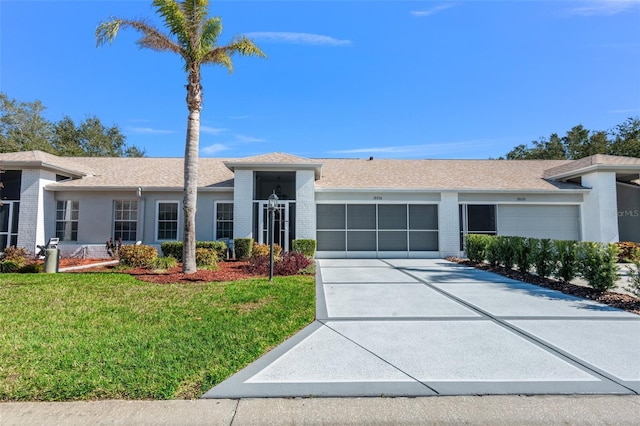 single story home with a garage and a front yard