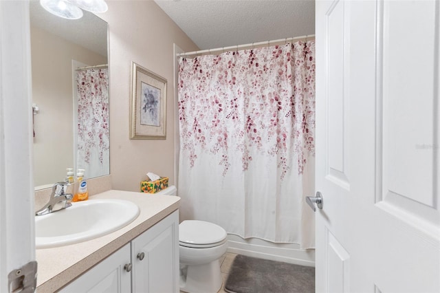 full bathroom featuring vanity, shower / bath combination with curtain, toilet, and a textured ceiling