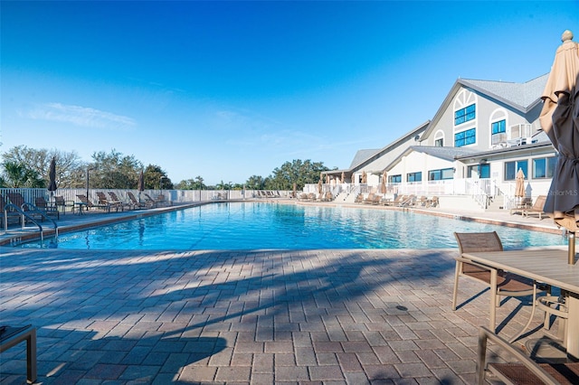 view of swimming pool featuring a patio