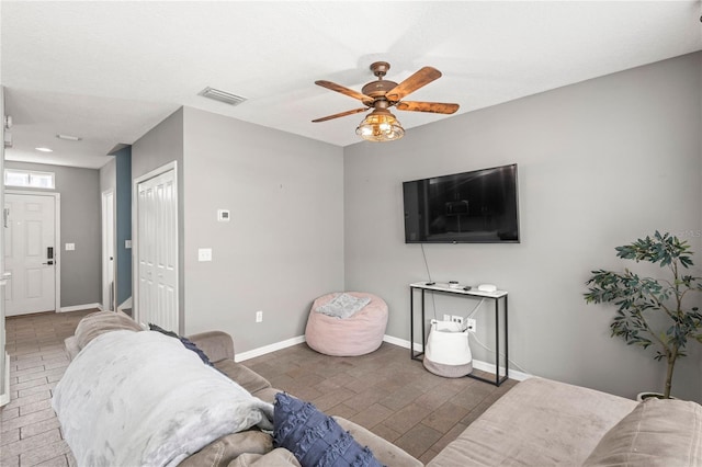 living room featuring ceiling fan