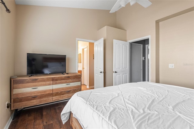 bedroom with dark hardwood / wood-style flooring and ceiling fan