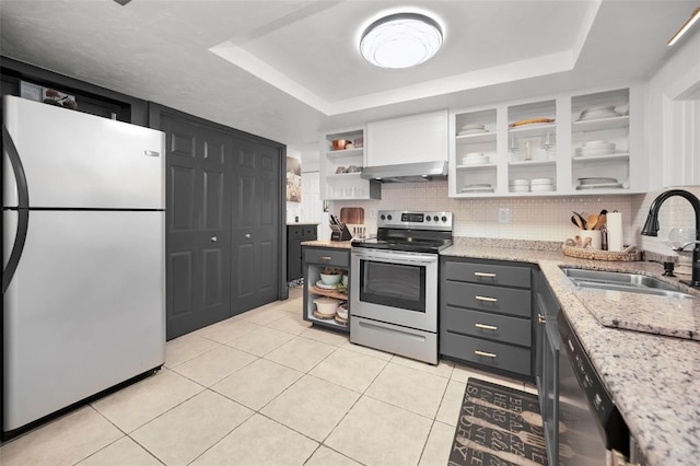 kitchen with gray cabinetry, light tile patterned flooring, white cabinets, and stainless steel appliances