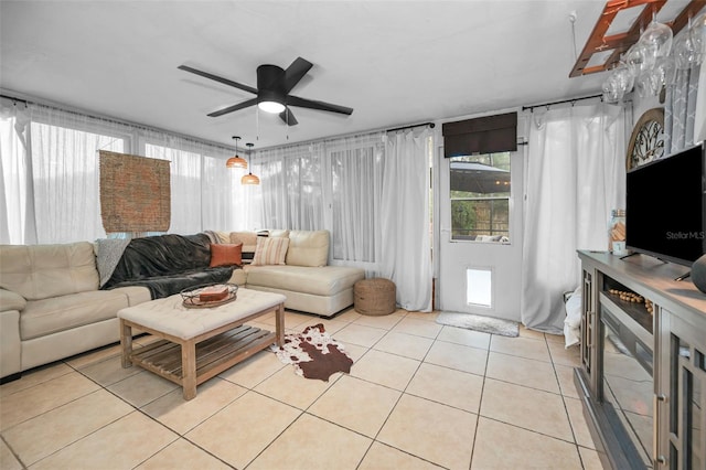 living room with ceiling fan and light tile patterned floors