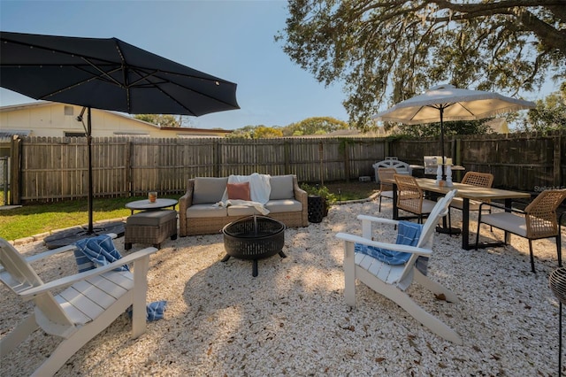 view of patio / terrace featuring an outdoor living space with a fire pit