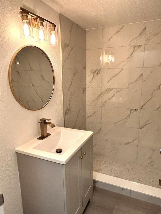 bathroom featuring vanity and a textured ceiling