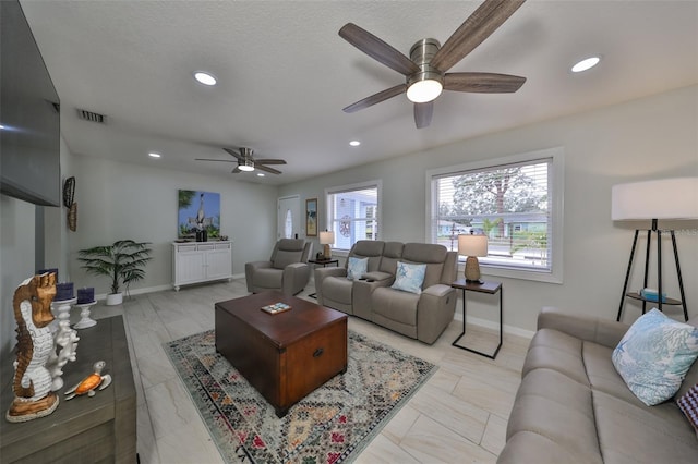 living room featuring ceiling fan