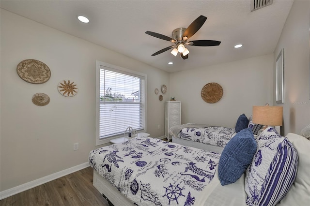 bedroom with ceiling fan and wood-type flooring