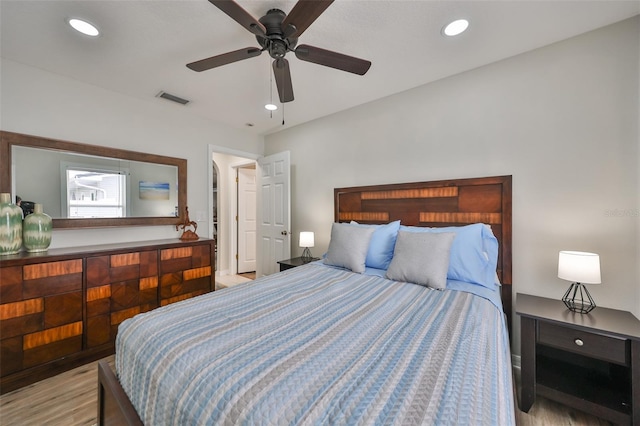 bedroom featuring ceiling fan and light hardwood / wood-style floors