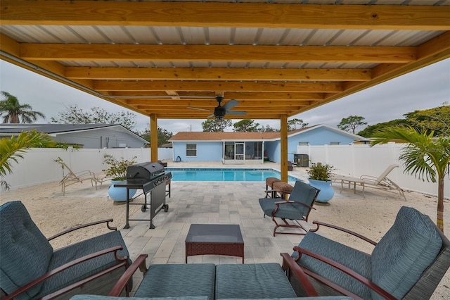 view of swimming pool featuring area for grilling and a patio area