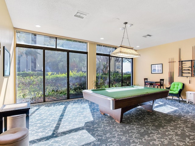 game room with a wealth of natural light, floor to ceiling windows, and billiards