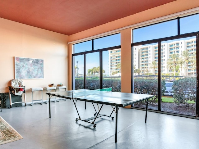 game room featuring concrete flooring