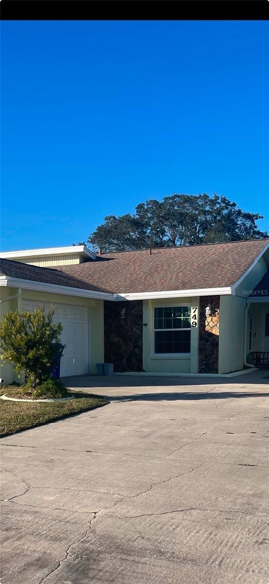 ranch-style house featuring a garage