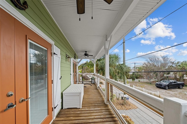 balcony featuring ceiling fan and french doors