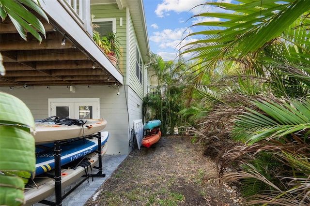 view of side of home with french doors