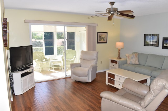 living room featuring ceiling fan and dark hardwood / wood-style flooring