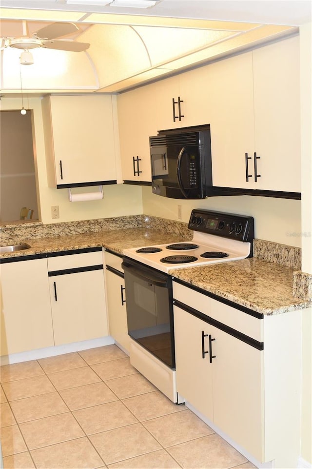 kitchen with ceiling fan, white range with electric stovetop, light tile patterned floors, white cabinets, and light stone counters